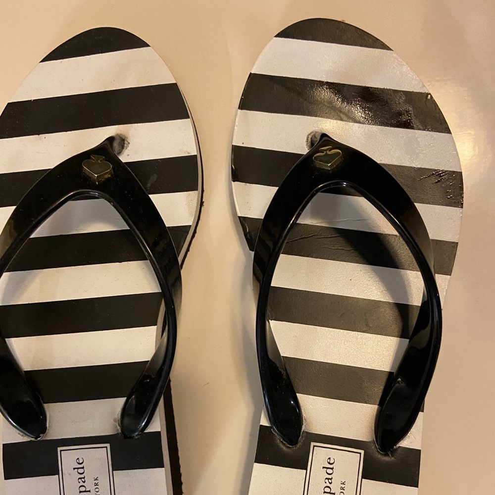 Kate Spade flip flops.  Size 5.  Black white